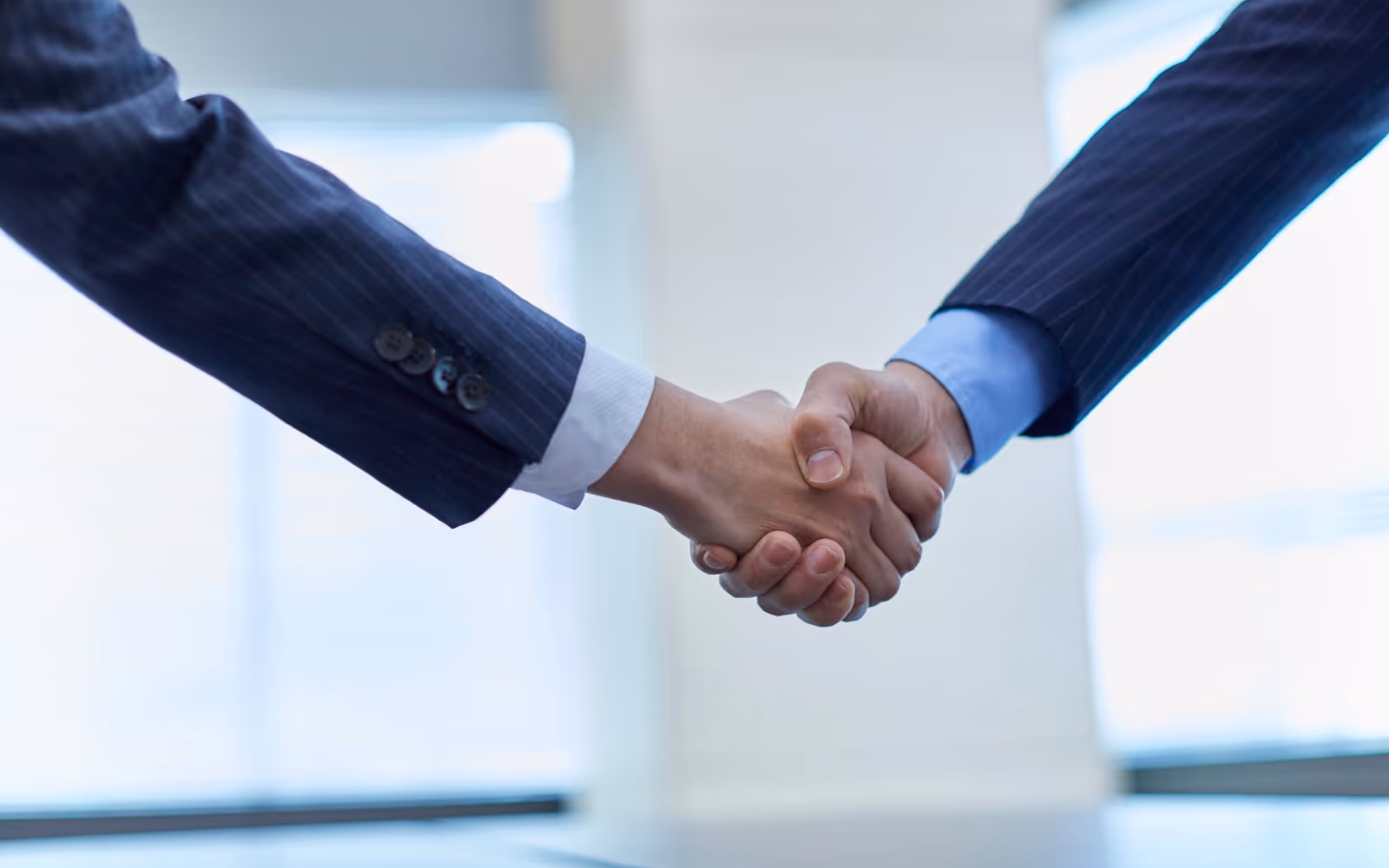 Handshake symbolising trust and loyalty between a business and its customers.